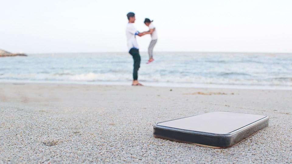 family playing on the beach