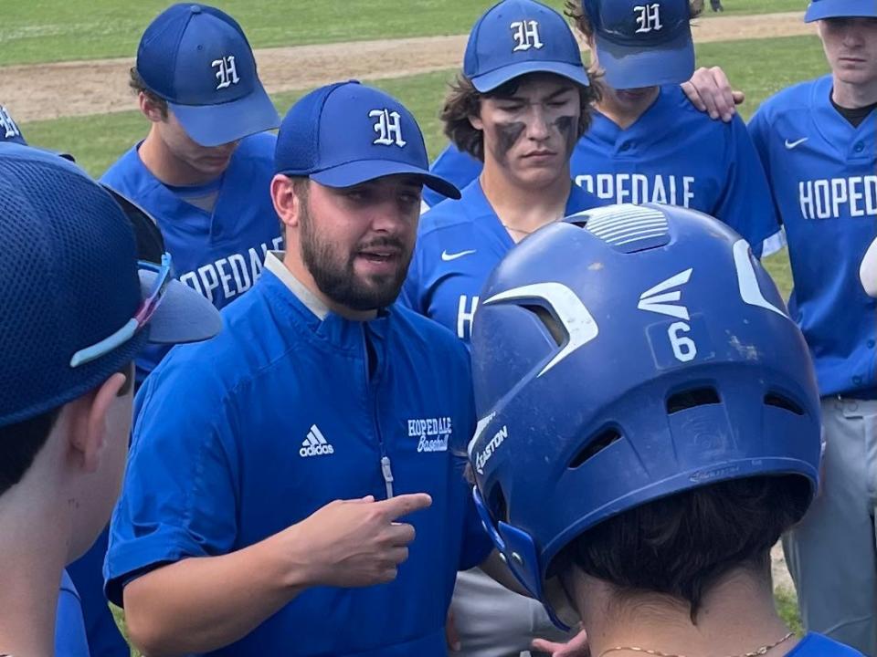 Hopedale baseball coach Kevin Bresciani speaks to his team between innings on Saturday in Hopedale.