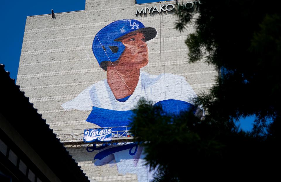 Artist Robert Vargas works on a mural of Shohei Ohtani. The 150 foot by 60 foot mural is on the east wall of the 11-story Miyako Hotel in the Little Tokyo District of Los Angeles. The mural will be officially unveiled on March 27, the day before the Dodgers play their first home game of the 2024 season.