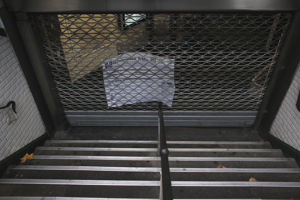 A subway station remains closed Friday, Dec. 6, 2019 in Paris. Frustrated travelers are meeting transportation chaos around France for a second day, as unions dig in for what they hope is a protracted strike against government plans to redesign the national retirement system. (AP Photo/Rafael Yaghobzadeh)