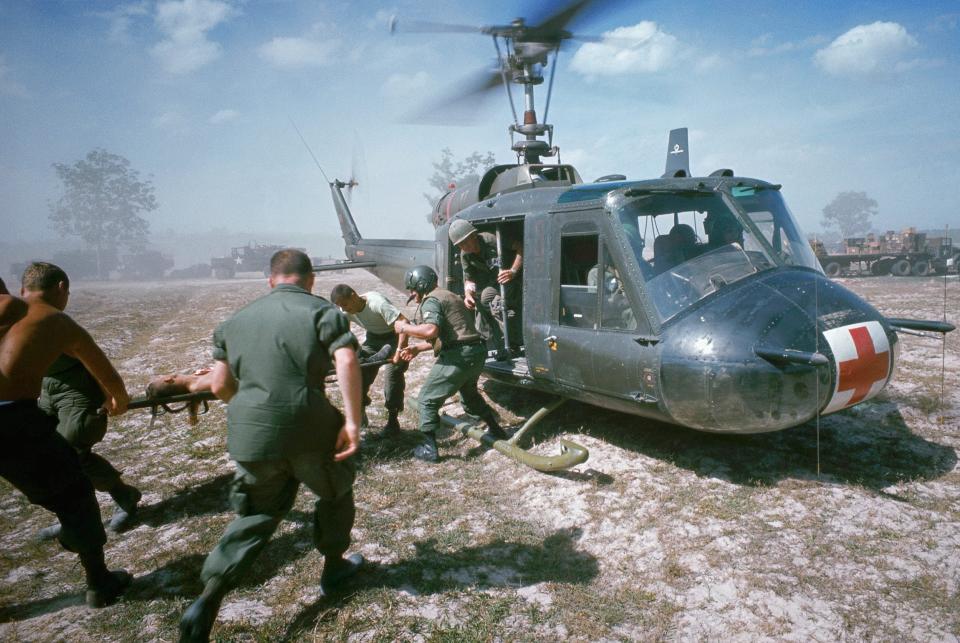 A Tim Page photo showing a helicopter airlifting victims of a booby trap explosion - 1968 - Tim Page/CORBIS/Corbis via Getty Images