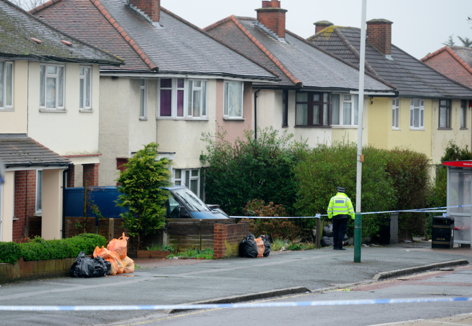 <em>A house is cordoned off and searched by police close to where the man was shot dead (SWNS)</em>