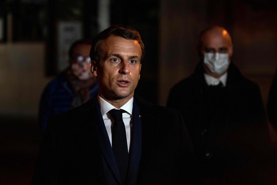 Mr Macron visited the scene of the crime after a crisis meeting (POOL/AFP via Getty Images)