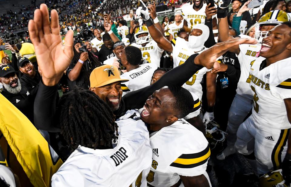 Alabama State head coach Eddie Robinson, Jr.,celebrate with players after defeating Alabama A&M University during the Magic City Classic at Legion Field in Birmingham, Ala., on Saturday October 29, 2022. 