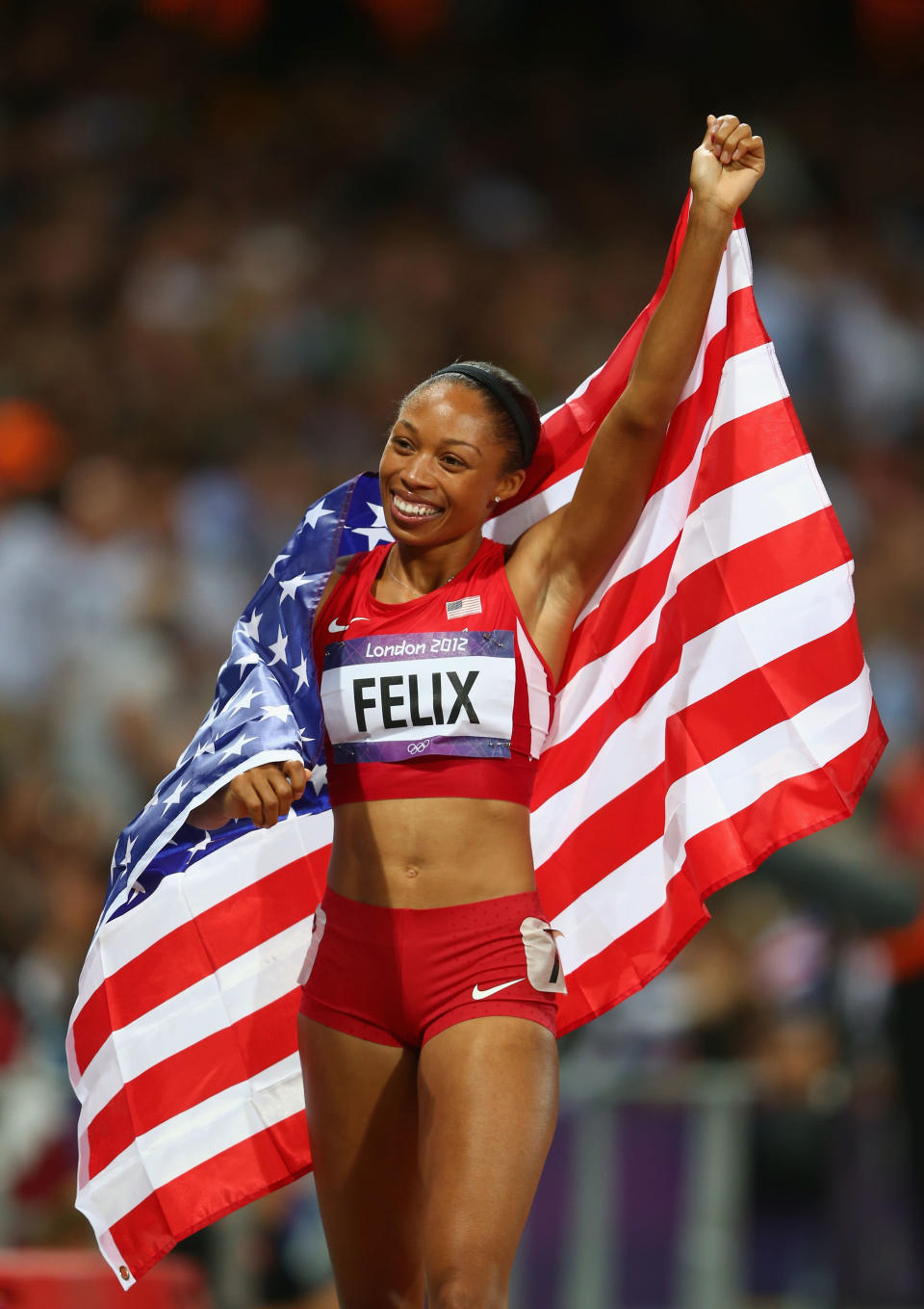 Allyson Felix of the United States celebrates after winning gold in the Women's 200m Final on Day 12 of the London 2012 Olympic Games at Olympic Stadium on August 8, 2012 in London, England. (Photo by Michael Steele/Getty Images)