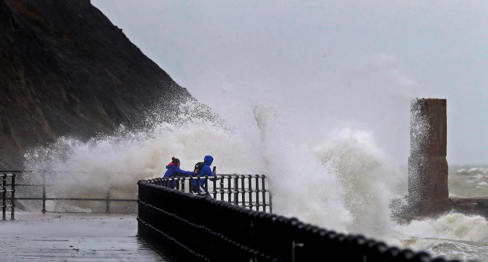 Impressive waves hit the harbour wall in Folkestone, Kent, over the weekend, prompting some people to try to capture the moment. (PA)