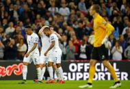 Football - England v Estonia - UEFA Euro 2016 Qualifying Group E - Wembley Stadium, London, England - 9/10/15 England's Theo Walcott celebrates scoring their first goal with James Milner and Nathaniel Clyne Reuters / Darren Staples