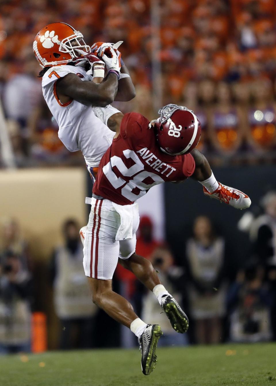 Clemson's Mike Williams catch over Alabama's Anthony Averett during the second half of the NCAA college football playoff championship game Tuesday, Jan. 10, 2017, in Tampa, Fla. (AP Photo/John Bazemore)