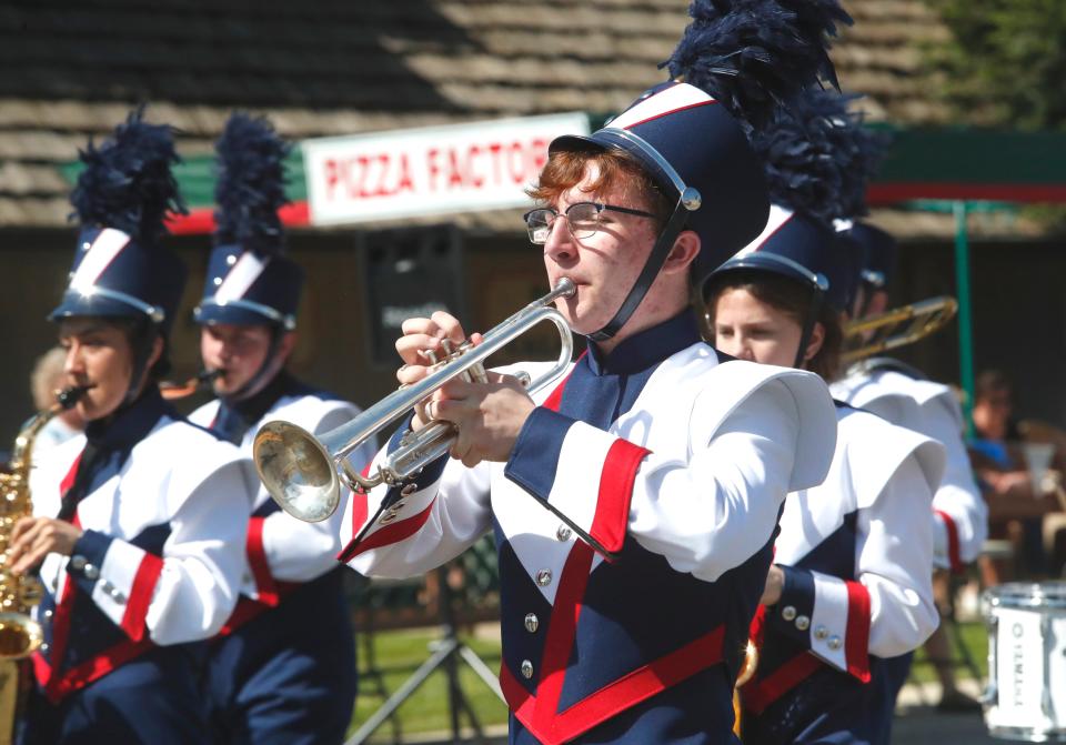 Julian Durr of the Central Valley High School Marching Band plays trumpet during the Boomtown Festival parade along Shasta Dam Boulevard on Saturday, May 4, 2019.