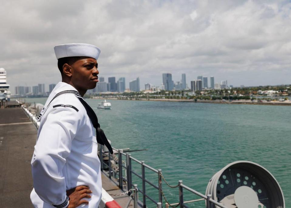 Erick Washington, religious program specialist, looks out at the bay and downtown Miami from the flight deck of the USS Bataan during the opening day of Fleet Week on Monday, May 6, 2024, at Norwegian Cruise Lines Terminal in PortMiami. Alie Skowronski/askowronski@miamiherald.com