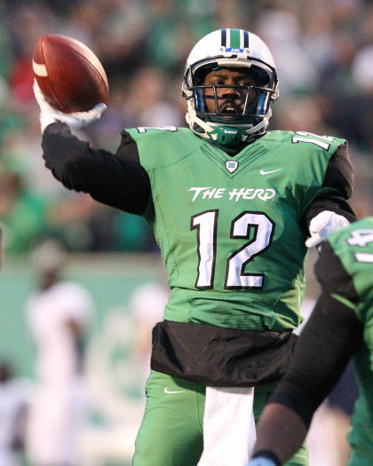 Nov 15, 2014; Huntington, WV, USA; Marshall Thundering Herd quarterback Rakeem Cato (12) passes for a touchdown to receiver Deon-Tay McManus against the Rice Owls. (Rob Leifheit-USA TODAY Sports)