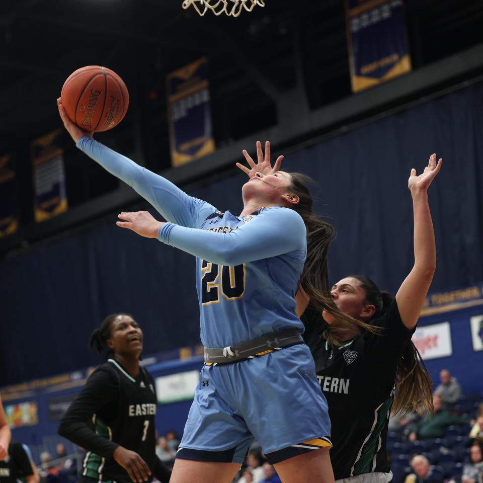 Kent State guard Clare Kelly goes underneath the basket to score during an NCAA basketball game against the Eastern Michigan University Eagles on Wednesday, January 18, 2023 at the Kent State M.A.C. Center.