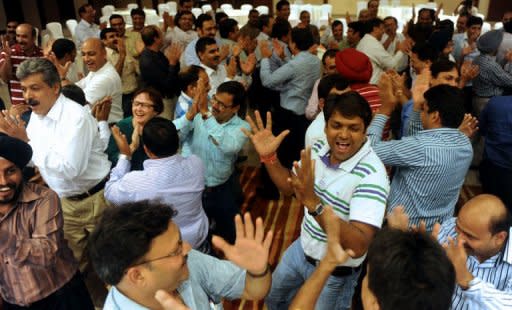 People take part in a session of a 'Laughter Club' in Greater Noida on the outskirts of New Delhi in August 2012. Researchers believe it may be the use of abdominal muscles in laughing that triggers the release of endorphins -- a phenomenon also associated with exercise, such as running