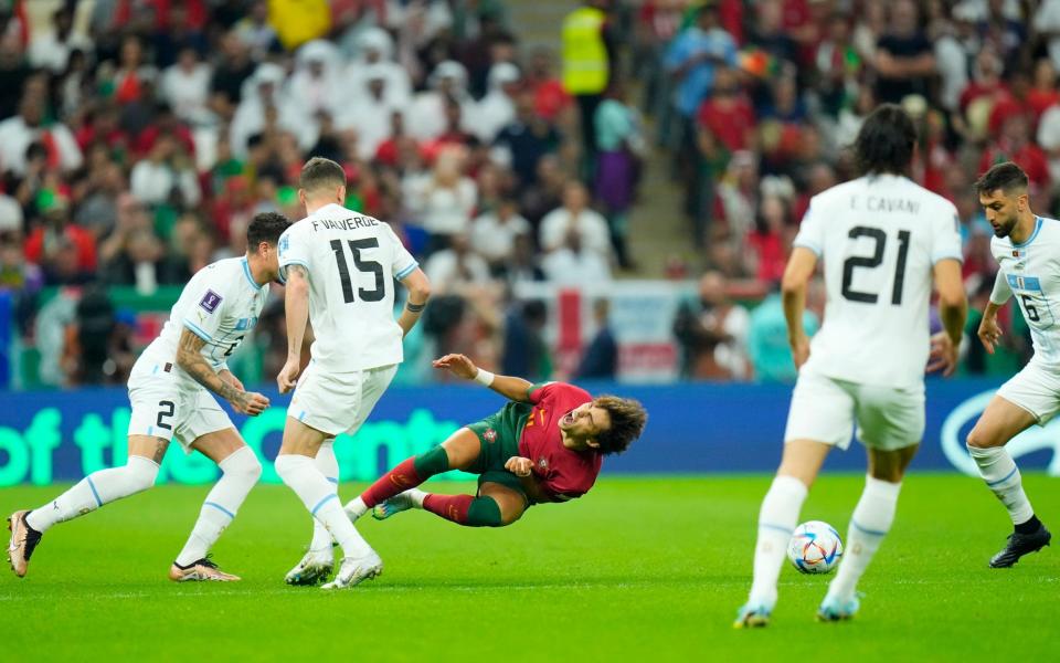 Portugal's Joao Felix hits the deck - AP