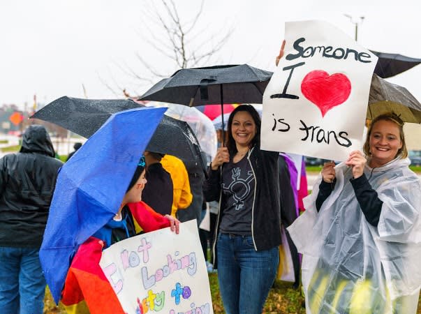 Two trans boys were kicked out of an ice skating rink during a “boys only” skate, so their moms protested against the rink. (Photo: Protest attendees/organizers)