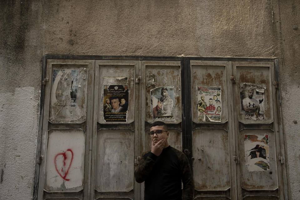 Yousef Mesheh, 15, who was detained along with his brother in a 3 a.m. raid by Israeli forces, stands in an alleyway in the Balata Refugee Camp in the northern West Bank, Tuesday, Jan. 10, 2023. His brother remains imprisoned. A report to be released next Monday by Israeli human rights organization HaMoked found that the Israeli military arrested and interrogated hundreds of Palestinian teenagers in 2022 in the occupied West Bank, without ever issuing a summons or notifying their families.(AP Photo/ Maya Alleruzzo)