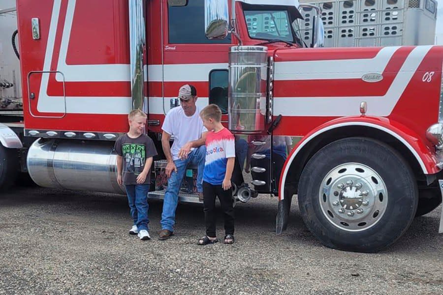 FILE – This undated family photo shows David Schultz with his two sons. The body of an Iowa trucker who went missing just before Thanksgiving has been found, according to his wife. The Iowa Department of Public Safety said Wednesday, April 25, 2024, that a body was found in a farm field near where David Schultz’s semi was found parking on a two-lane highway. (Family photo via AP)