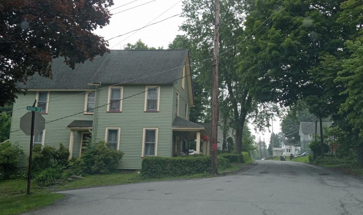 Honesdale council is considering whether a stop sign is appropriate on Ridge Street, at right, where it meets the corner with Vine Street at left. Ridge Street resident Joseph Mele stated drivers headed down (northbound, towards the foreground) Ridge Street cannot easily tell if a vehicle is coming off of Vine onto Ridge. Note how Ridge Street is narrower at this point, in front of the home at 421 Ridge Street. Mele suggested having either a stop sign or flashing light to make the junction safer.