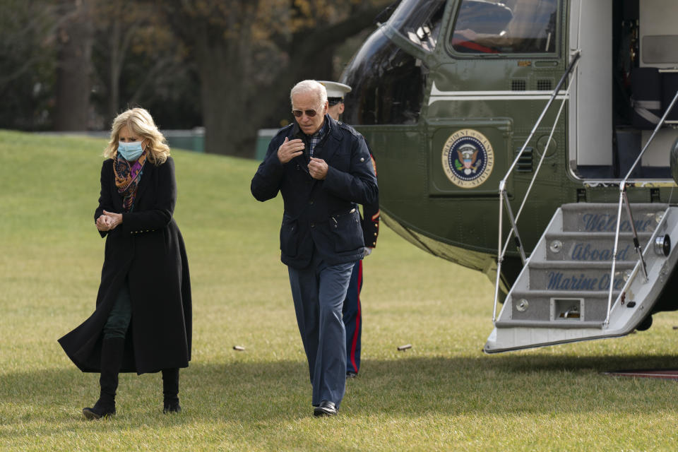 President Joe Biden and first lady Jill Biden arrive at the White House on Marine One, Sunday, Dec. 5, 2021, in Washington, as they return from Camp David, Md. (AP Photo/Carolyn Kaster)