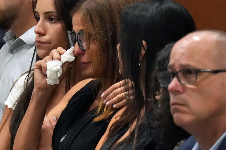 Patricia Padauy Oliver is comforted as a witness testifys to her son’s fatal injuries during the penalty phase of the trial of Marjory Stoneman Douglas High School shooter at the Broward County Courthouse in Fort Lauderdale on Monday, August 1, 2022.