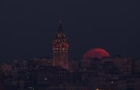 <p>Full moon is seen over Galata Tower in Istanbul, Turkey on Jan. 31, 2018. (Photo: Emrah Yorulmaz/Anadolu Agency/Getty Images) </p>