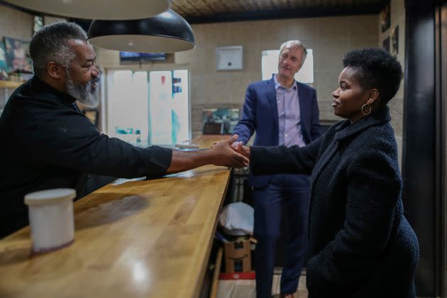 India Walton, right, tours a local business with state Sen. Sean Ryan (D). Progressives were frustrated by some Democrats' decision to stay out of the race after Walton won the primary. (Photo: Joshua Bessex/Associated Press)