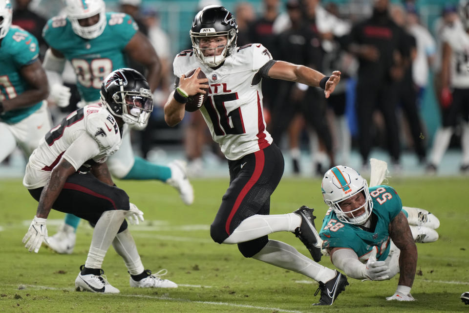 Atlanta Falcons quarterback Nathan Rourke (16) runs with the ball during the second half of a pre season NFL football game against the Miami Dolphins, Friday, Aug. 9, 2024, in Miami Gardens, Fla. (AP Photo/Wilfredo Lee)