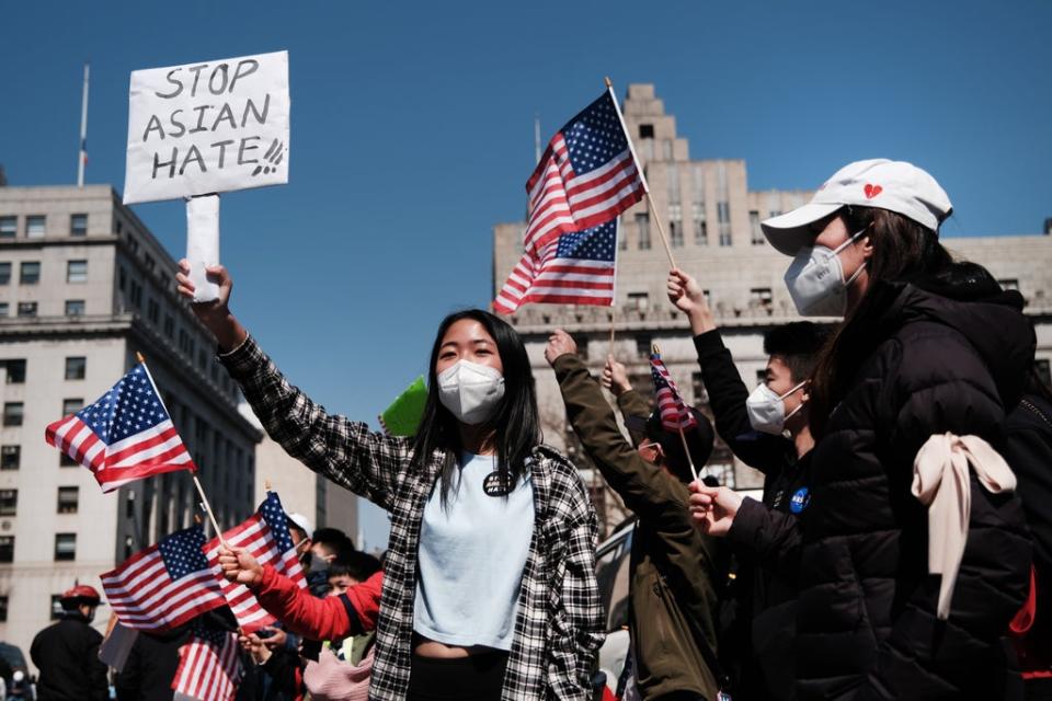 People participate in a protest to demand an end to anti-Asian violence on April 04, 2021 (Getty)