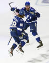 Tampa Bay Lightning defenseman Mikhail Sergachev (98) celebrates his goal against the Dallas Stars with teammate Erik Cernak (81) during the third period of Game 5 of the NHL hockey Stanley Cup Final, Saturday, Sept. 26, 2020, in Edmonton, Alberta. (Jason Franson/The Canadian Press via AP)