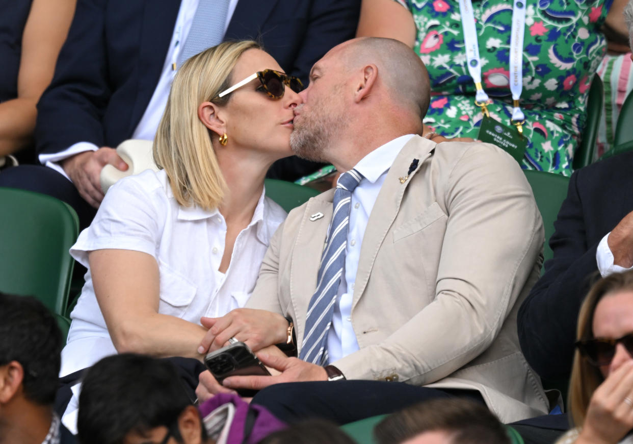 LONDON, ENGLAND - JUNE 28: Zara Phillips and Mike Tindall kiss as they attend Day Two of Wimbledon 2022 at All England Lawn Tennis and Croquet Club on June 28, 2022 in London, England. (Photo by Karwai Tang/WireImage)