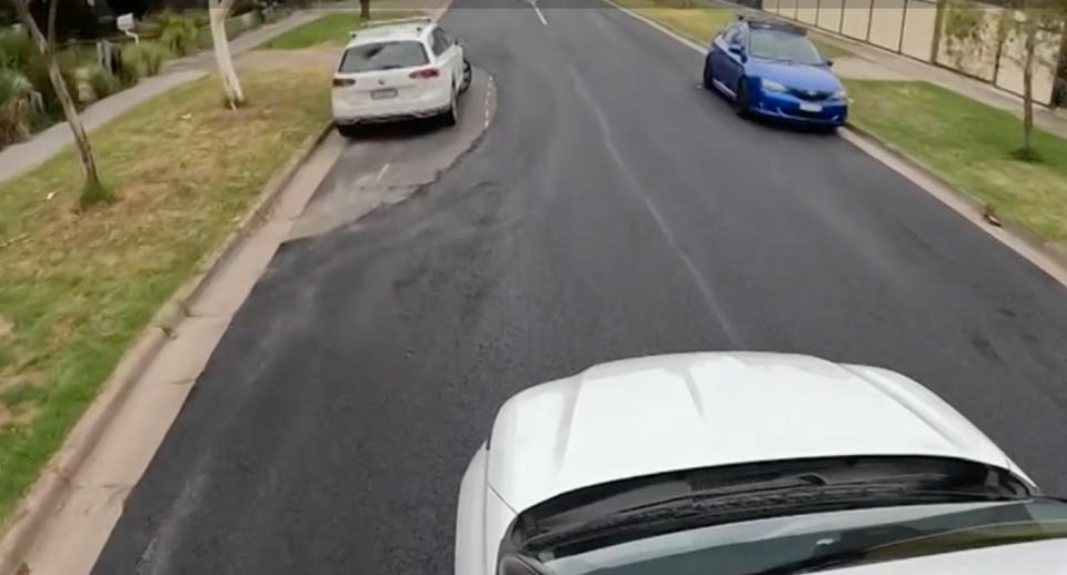 The resurfacing around a white car on McBryde Street performed by Merri-bek City Council contractors.