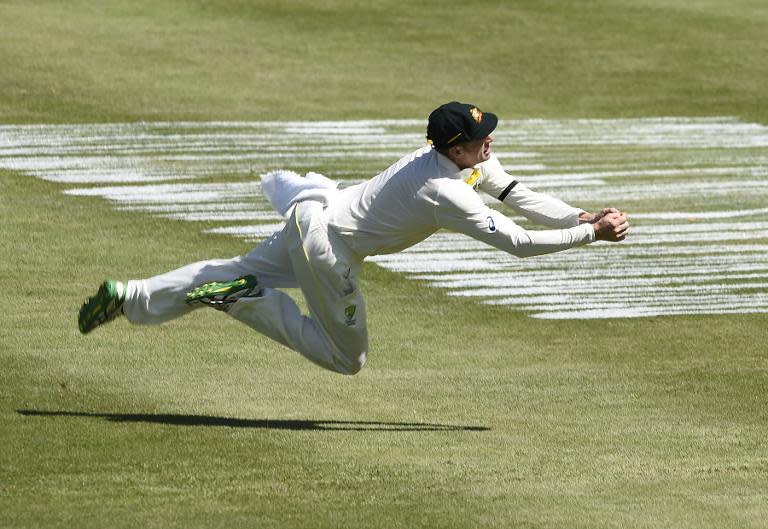 Australia cricketer Adam Voges catches out West Indies batman Jerome Taylor on the first day of the first cricket Test match, June 3, 2015 at Windsor Park Stadium in Roseau, Dominica