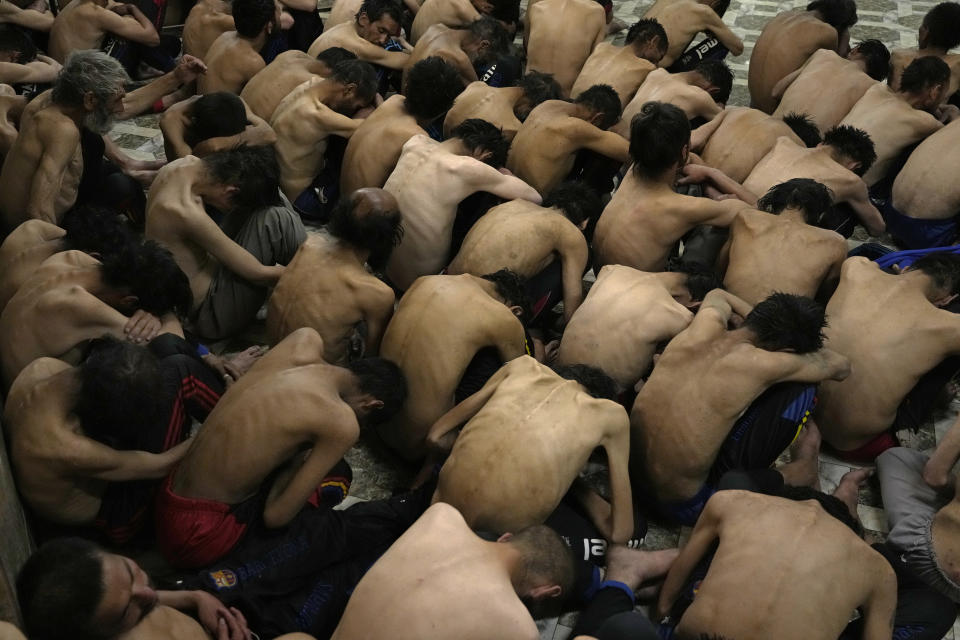 Drug addicts detained during a Taliban raid wait to have their heads shaved in a drug addiction treatment camp in Kabul, Afghanistan, Tuesday, May 31, 2022. Drug addiction has long been a problem in Afghanistan, the world’s biggest producer of opium and heroin. The ranks of the addicted have been fueled by persistent poverty and by decades of war that left few families unscarred. (AP Photo/Ebrahim Noroozi)