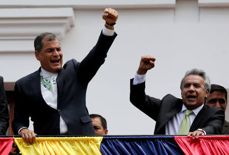 Ecuador's President Rafael Correa (L) and Presidential candidate Lenin Moreno greet supporters as they stand on the government palace's balcony during a military change of guard ceremony in Quito, Ecuador April 3, 2017. REUTERS/Mariana Bazo