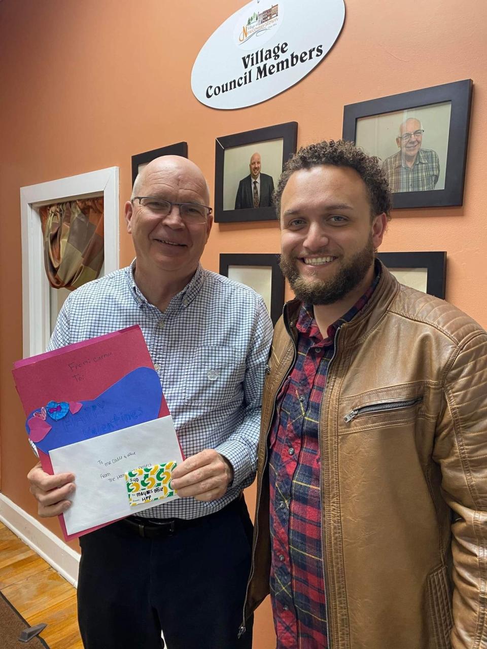 Daniel Bias (right), of the Home Plate Project, is pictured with Newcomerstown Mayor Pat Cadle as the faith-based Project took food and Valentine's Day cards to Tri-County EMS, Newcomerstown Emergency Rescue Squad, Inc.  Newcomerstown Mayor's Office, Newcomerstown Board of Education , Newcomerstown Police Department, Newcomerstown Fire Department and the Newcomerstown Chamber of Commerce.