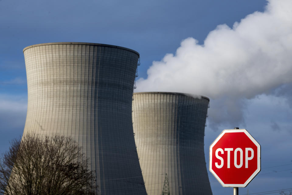 FILE - Steam rises from the cooling tower of the nuclear power plant of Gundremmingen, Bavaria, Friday, Dec. 31, 2021. Draft European Union plans that would allow nuclear and gas energy to remain part of the bloc's path to a climate-friendly future came under immediate criticism over the weekend from both environmentalists and some governing political parties in EU member nations. Germany shut three plants, including this one, at the end of last year. (Stefan Puchner/dpa via AP)