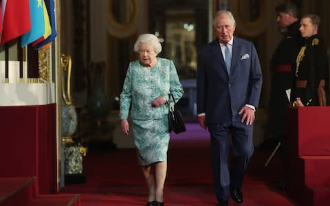 The Queen and Prince of Wales arrive at the opening of CHOGM together - Credit: Jonathan Brady /PA