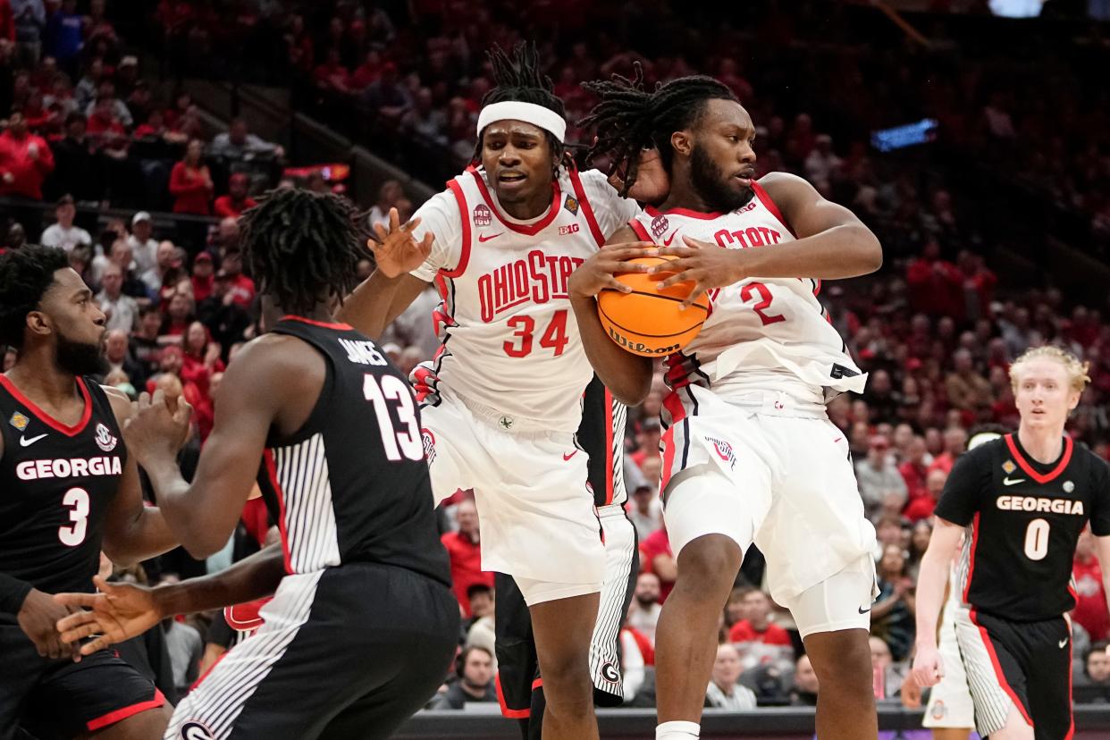 Mar 26, 2024; Columbus, OH, USA; Ohio State Buckeyes guard Bruce Thornton (2) and center Felix Okpara (34) scramble for a rebound in front of Georgia Bulldogs guard Noah Thomasson (3) and forward Dylan James (13) during the second half of the NIT quarterfinals at Value City Arena. Ohio State lost 79-77.