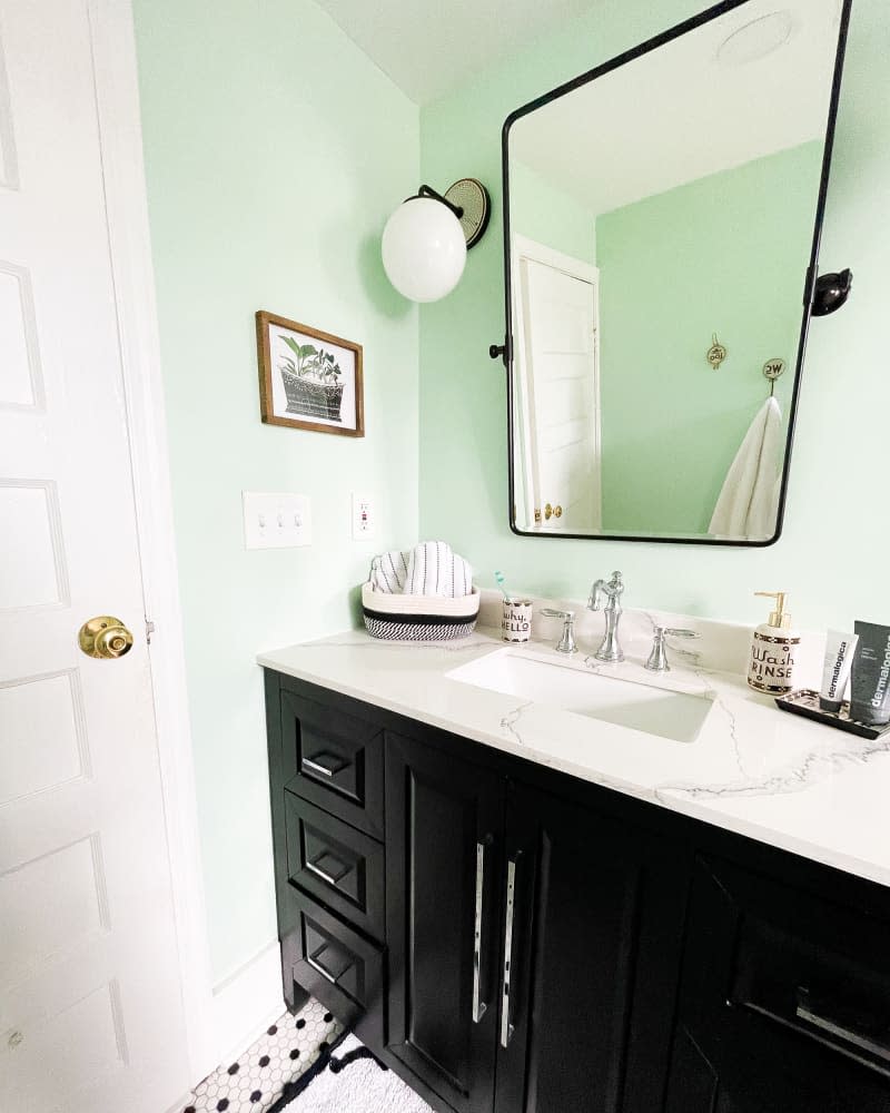 Marble top on black bathroom vanity.