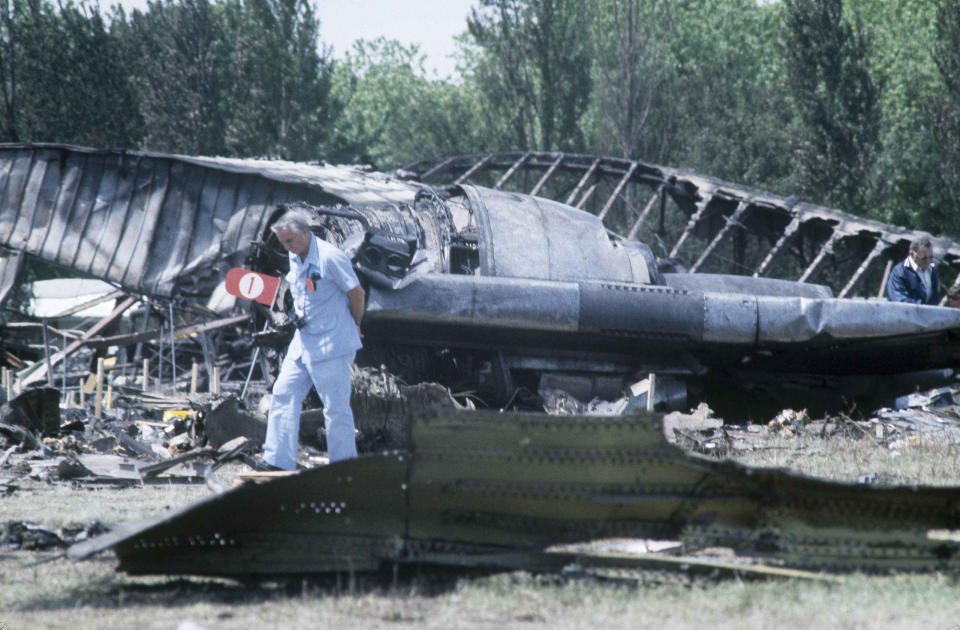 FILE - In this May 26, 1979 file photo, investigators view the wreckage of the ill-fated American Airlines Flight 191 to Los Angeles, which crashed on take off from O'Hare International Airport in Chicago. Decades later, the crash, moments after it took off, remains the deadliest aviation accident in U.S. history. The DC-10 was destined for Los Angeles when it lost one of its engines May 25, 1979, killing what investigators later determined were 273 people _ all 271 people aboard the jetliner and two people on the ground. (AP Photo/Fred Jewell File)