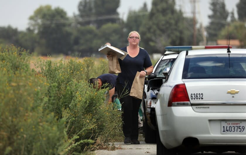PICO RIVERA-CA-JUNE 22, 2022: Investigators on the scene where a woman and her two dogs were killed by an apparent lightning strike along the San Gabriel River & Bike Trail in Pico Rivera on Wednesday, June 22, 2022. (Christina House / Los Angeles Times)