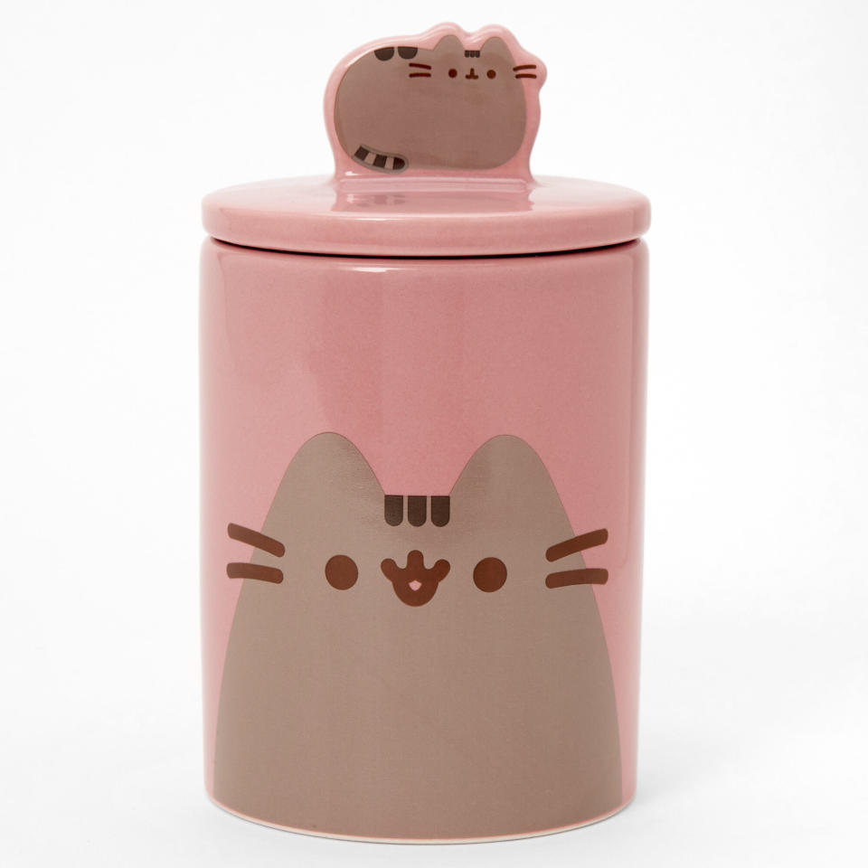 <p>This Pusheen jar ensures you get a smile every time you reach for a cat treat. </p> <p><strong>Buy it!</strong> Pusheen Treat Jar, $18.99; <a href="https://www.claires.com/us/pusheen-treat-jar---pink-279401.html" rel="nofollow noopener" target="_blank" data-ylk="slk:Claires.com;elm:context_link;itc:0;sec:content-canvas" class="link ">Claires.com</a></p>