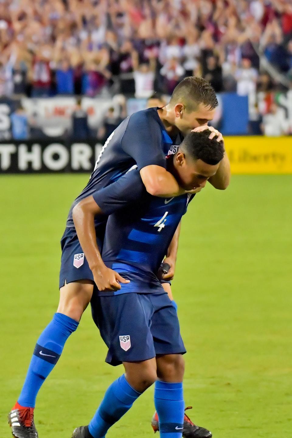 United States midfielder Wil Trapp, left, celebrates with midfielder Tyler Adams after defeating Mexico during an international friendly soccer match at Nissan Stadium in Nashville in September 2018.