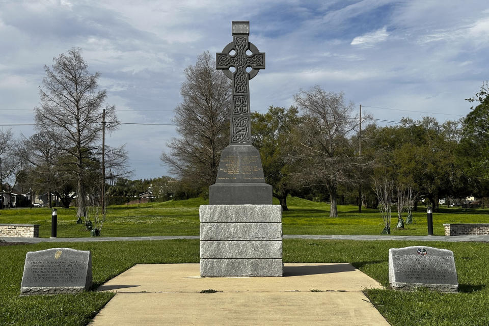 A Celtic Cross at Hibernian Memorial Park in New Orleans is seen on Thursday, March 7, 2024. The park sits on the site of the now filled-in New Basin Canal and is a tribute to Irish laborers who built the canal in the 1800s. Although New Orleans is better known for French, Spanish, African American and Caribbean influences, the Irish have played a major role in the its history, and the city celebrates the legacy with parades and parties centered around the March 17 St. Patrick's Day holiday. (AP Photo/Stephen Smith)