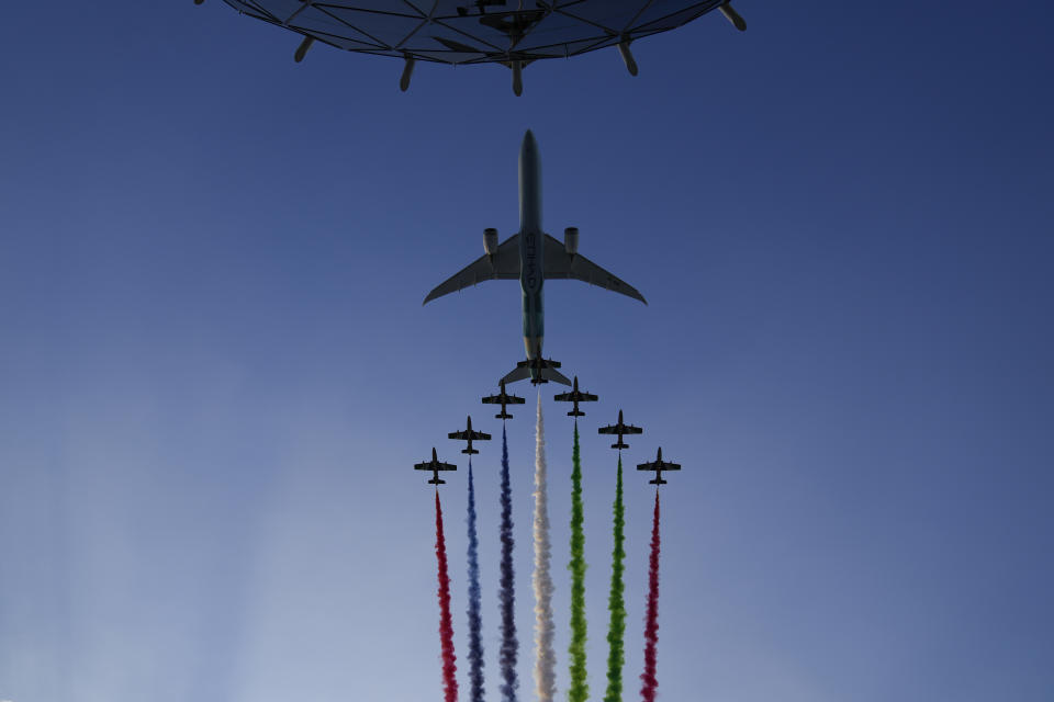 Aircraft fly over the track bbefore the Formula One Abu Dhabi Grand Prix in Abu Dhabi, United Arab Emirates, Sunday, Dec. 12. 2021. (AP Photo/Hassan Ammar)