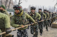 Indian soldiers hold rope as they guard India's opposition Congress party leader Rahul Gandhi, and other leaders during a 5-month-long "Unite India March," in Srinagar, Indian controlled Kashmir, Sunday, Jan. 29, 2023. The countrywide trek, that began from the southernmost tip of India, on Sept. 7., is expected to traverse 3,570 kilometers (2,218 miles) and cross 12 states before finishing in Indian-controlled Kashmir. (AP Photo/Mukhtar Khan)