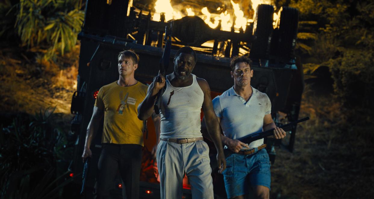 Rick Flag (Joel Kinnaman, left), Bloodsport (Idris Elba) and Peacemaker (John Cena) go undercover during a dangerous mission in "The Suicide Squad."