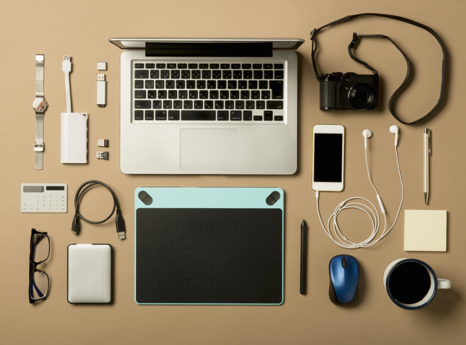 Is your desk filled with electronics? These accessories can help with that. (Photo: Getty)
