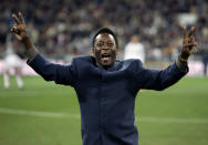 FILE - Brazil's soccer legend Pele greets the crowd ahead of a Spanish league soccer match, in the Santiago Bernabeu stadium in Madrid, Jan. 16, 2005. Pelé, the Brazilian king of soccer who won a record three World Cups and became one of the most commanding sports figures of the last century, died in Sao Paulo on Thursday, Dec. 29, 2022. He was 82. (AP Photo/Jasper Juinen, File)