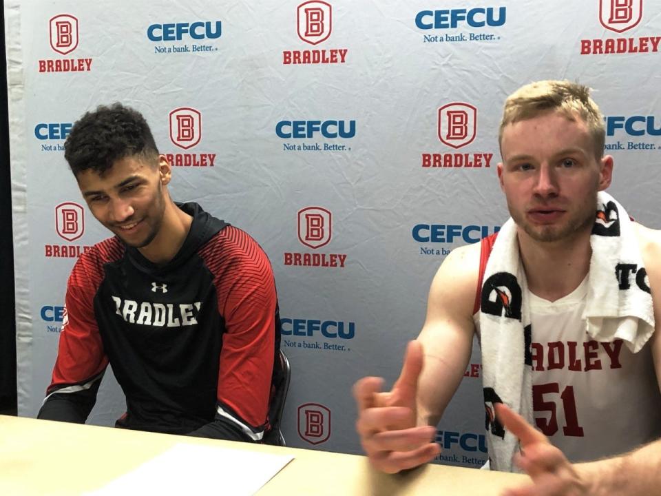 Malevy Leons (left) and fellow Netherlands native Rienk Mast answer post-game questions after helping Bradley Braves to a victory at Carver Arena in the 2022-23 season.